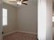 Light-filled bedroom featuring neutral walls, carpet, and a ceiling fan, offering a comfortable space at 1359 Greenfield Loop, Kissimmee, FL 34747