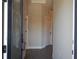 Inviting hallway with neutral walls and wood-look floors at 1359 Greenfield Loop, Kissimmee, FL 34747