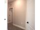 Bright hallway with neutral walls and white trim at 1359 Greenfield Loop, Kissimmee, FL 34747