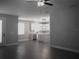 Open-concept living area flows into a modern kitchen at 1359 Greenfield Loop, Kissimmee, FL 34747