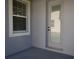 Outdoor patio featuring a glass door and window showing its exterior view at 1359 Greenfield Loop, Kissimmee, FL 34747