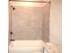 Clean and bright shower-tub with neutral tile and chrome fixtures at 1359 Greenfield Loop, Kissimmee, FL 34747