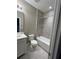 Bathroom featuring a tub and shower combo, toilet, and vanity sink at 14419 Magnolia Ridge Loop, Winter Garden, FL 34787