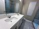 Bathroom featuring double sinks, a glass shower and modern fixtures at 14419 Magnolia Ridge Loop, Winter Garden, FL 34787