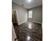 Cozy bedroom with wood floors, closet and a window bringing in natural light at 14419 Magnolia Ridge Loop, Winter Garden, FL 34787