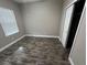 Well-lit bedroom with wood floors, closet and a window at 14419 Magnolia Ridge Loop, Winter Garden, FL 34787