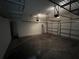 Spacious garage with three doors and overhead storage racks at 14419 Magnolia Ridge Loop, Winter Garden, FL 34787