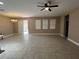 Open living space with tile floors, a ceiling fan, and sliding glass doors at 14419 Magnolia Ridge Loop, Winter Garden, FL 34787