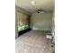 Covered patio with tile floor and ceiling fan at 14419 Magnolia Ridge Loop, Winter Garden, FL 34787