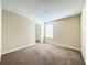 Spacious bedroom with neutral walls, carpet, a window with blinds, and a closet at 15129 Driftwood Bend St, Winter Garden, FL 34787