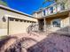 Two-story home featuring a two-car garage and a brick-paved driveway on a sunny day at 15129 Driftwood Bend St, Winter Garden, FL 34787