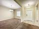 Bright living room featuring neutral paint, carpeted floors, and a decorative chandelier at 15129 Driftwood Bend St, Winter Garden, FL 34787