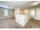 Cozy loft space featuring neutral walls, carpet, and ample natural light at 15129 Driftwood Bend St, Winter Garden, FL 34787