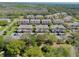 Sprawling community featuring coordinated townhomes, well-maintained grounds, and lush surroundings at 1645 Retreat Cir, Clermont, FL 34714
