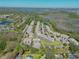Overhead of a community nestled amongst woods, lakes, and ponds providing a serene living environment at 1645 Retreat Cir, Clermont, FL 34714