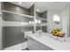 Modern bathroom showcasing a white vanity and a glass-enclosed shower at 1645 Retreat Cir, Clermont, FL 34714