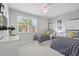 Bedroom with two twin beds, a large window and bright light at 1645 Retreat Cir, Clermont, FL 34714