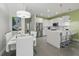 Open-concept living space with modern kitchen, stainless steel appliances, and a dining area at 1645 Retreat Cir, Clermont, FL 34714