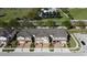 An aerial view of the townhomes featuring brick-paved driveways and community landscaping nestled in a well-maintained neighborhood at 1737 Kato Way, Kissimmee, FL 34744