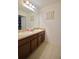 Bathroom featuring double sinks, granite countertop, and tile flooring at 1737 Kato Way, Kissimmee, FL 34744