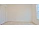 Clean bedroom with neutral carpet, closet, and bright window provides calm ambiance at 1737 Kato Way, Kissimmee, FL 34744