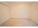 A clean, well-lit bedroom with neutral carpet and a spacious closet provides a blank canvas at 1737 Kato Way, Kissimmee, FL 34744