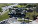 An aerial view shows the community clubhouse, playground, parking area, and nearby traffic at 1737 Kato Way, Kissimmee, FL 34744