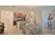Open-concept dining area featuring tile floors, ample natural light, and staircase access at 1737 Kato Way, Kissimmee, FL 34744