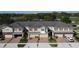 Charming townhomes with brick-paved driveways, well-maintained landscaping, and neutral exteriors create an inviting curb appeal at 1737 Kato Way, Kissimmee, FL 34744