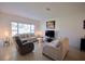 Comfortable living room featuring neutral tones, natural light, and modern furnishings at 1737 Kato Way, Kissimmee, FL 34744