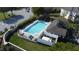 Aerial view of the community pool, including pool furniture and the surrounding grounds at 1737 Kato Way, Kissimmee, FL 34744