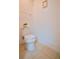 Powder room featuring a tiled floor and a modern toilet with white walls at 1737 Kato Way, Kissimmee, FL 34744