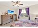 Bedroom featuring wood flooring, natural light from the window, and furnishings at 17418 Blazing Star Cir, Clermont, FL 34714