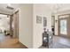 Inviting entryway featuring a decorative console table, chandelier, and easy access to the laundry room at 17418 Blazing Star Cir, Clermont, FL 34714