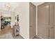 Entryway featuring hardwood floors, chandelier, and gray console table with decorated doors at 17418 Blazing Star Cir, Clermont, FL 34714