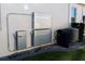 Side view of home showing the installed HVAC and storage battery equipment at 17418 Blazing Star Cir, Clermont, FL 34714