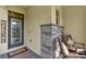 Inviting front porch with brick accents, cozy seating, and a stylish welcome sign at 17418 Blazing Star Cir, Clermont, FL 34714