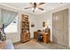 Home office with natural light, wood flooring, and ample workspace at 17418 Blazing Star Cir, Clermont, FL 34714