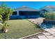 Exterior view of home with screened-in porch and landscaped yard at 181 Whisper Wood Ct, Kissimmee, FL 34743