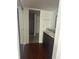Bathroom with a view to the shower featuring dark wood cabinets, double sinks and laminate floors at 1926 Cattleya Dr, Kissimmee, FL 34741