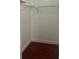 Walk-in closet with laminate wood flooring and wire shelving at 1926 Cattleya Dr, Kissimmee, FL 34741