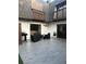 Charming courtyard with modern outdoor seating, grill, and manicured landscaping at 1926 Cattleya Dr, Kissimmee, FL 34741