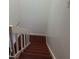 View from the top of the staircase with wood stairs and white railings at 1926 Cattleya Dr, Kissimmee, FL 34741
