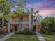 Inviting two-story condo with lush landscaping and charming exterior features at 204 New Providence # 10104, Davenport, FL 33897