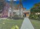 Charming two-story condo with a private entrance, lush landscaping and sunny skies at 204 New Providence # 10104, Davenport, FL 33897