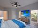 Serene bedroom with modern ceiling fan, and a private balcony at 204 New Providence # 10104, Davenport, FL 33897