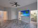 Serene bedroom with modern ceiling fan, and a private balcony at 204 New Providence # 10104, Davenport, FL 33897
