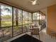 Relaxing screened patio with outdoor seating and views of the landscaped backyard at 204 New Providence # 10104, Davenport, FL 33897