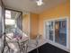 Enclosed patio with outdoor seating, a ceiling fan, and serene views of the surrounding landscape at 204 New Providence # 10104, Davenport, FL 33897