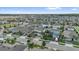 Aerial view of a neighborhood with well-kept lawns and mature trees, on a sunny day at 2129 Stillwood Way, St Cloud, FL 34771
